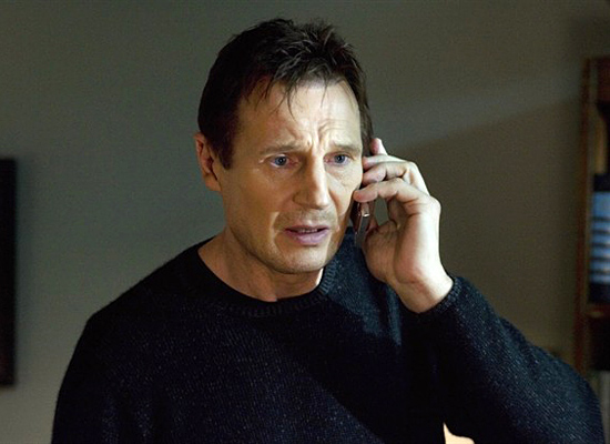 Liam Neeson on a cell phone